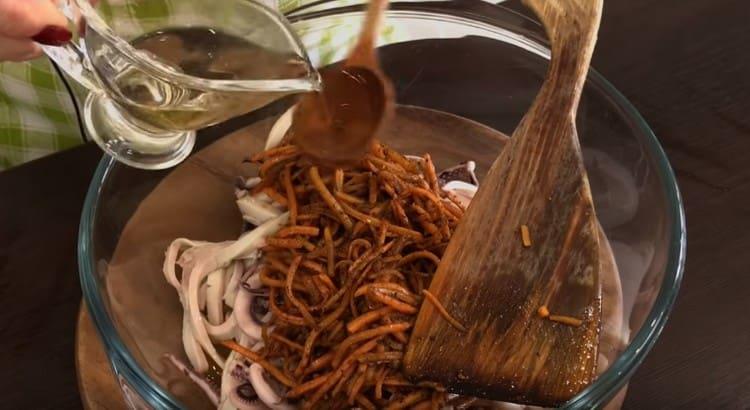 Add carrots and vinegar to the squid.