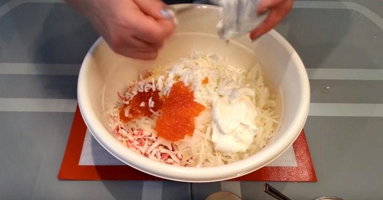 Dress salad with mayonnaise.