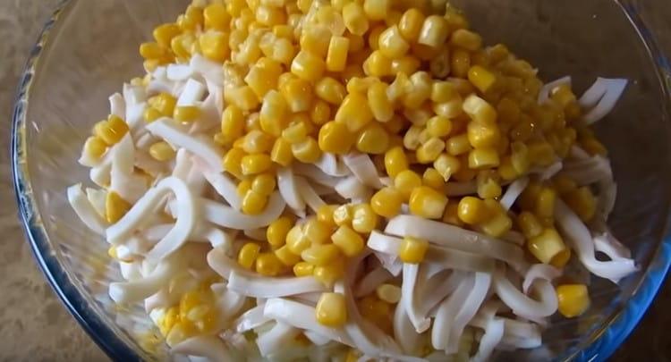 Add canned corn to the salad.