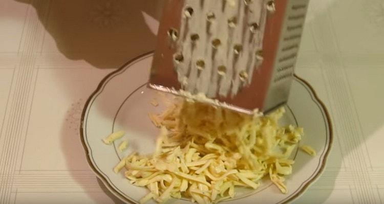 grate the melted cheese.