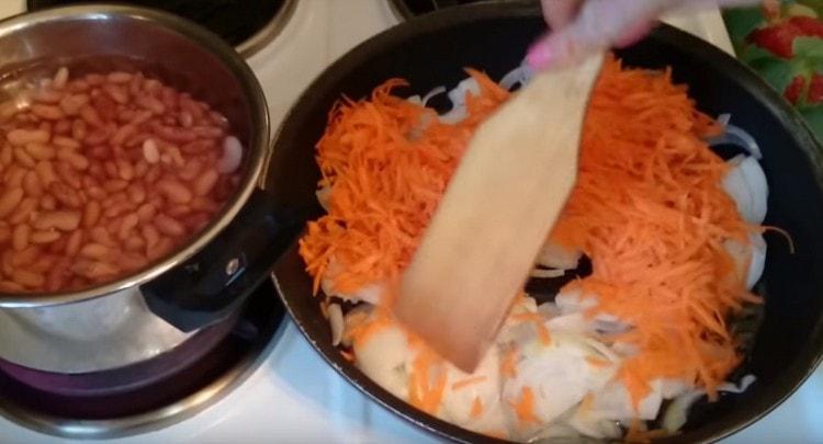 fry carrots and onions until tender in a pan.