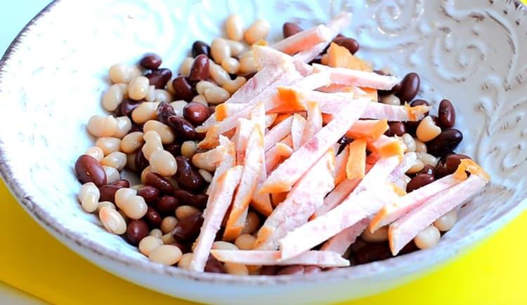 Add the sausage to the beans.