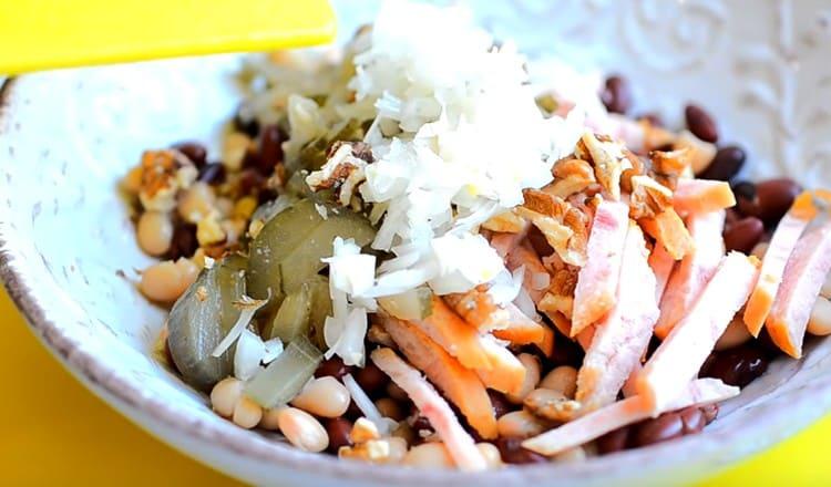 Add the roasted nuts, cucumber and onions.