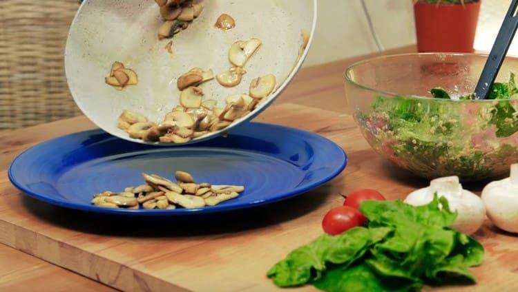 We shift the mushrooms on a serving dish.