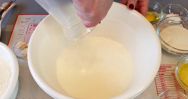 pour warmed milk into a bowl.