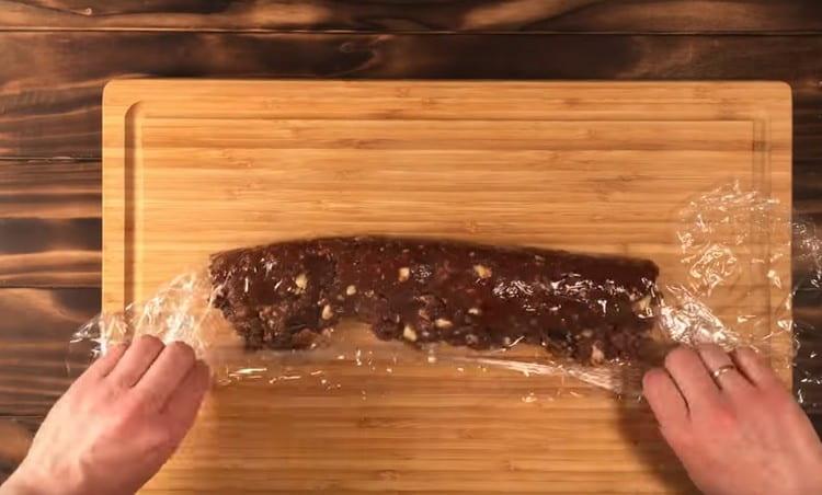We spread the prepared chocolate mass on the film and wrap it in the form of sausages.