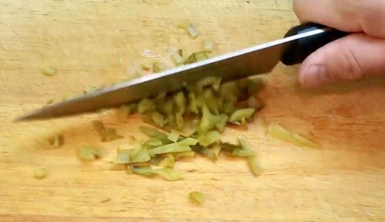 Grind pickled cucumbers.