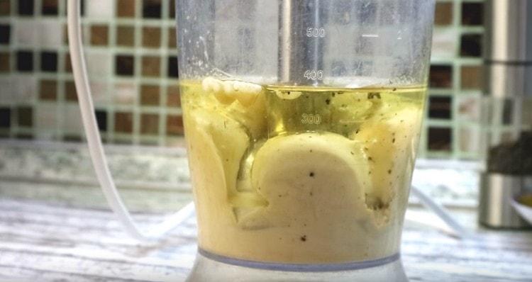 Next, raise the blender leg, grabbing oil.