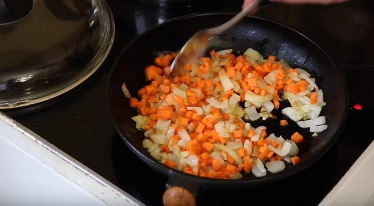 Add carrots to the onion.