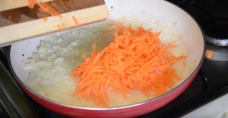 Add the grated carrots to the onion.