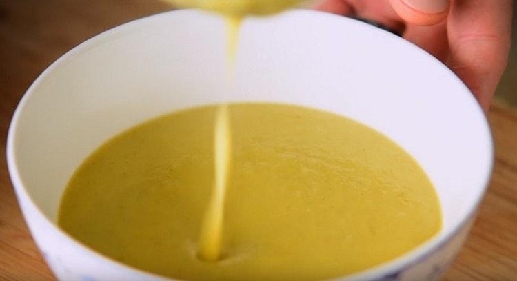 Pour soup into plates.