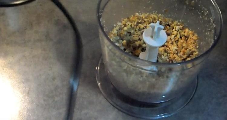 Grind walnuts with a blender.