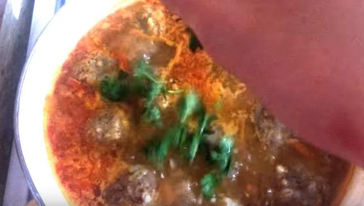 At the end of cooking, add chopped greens to the soup.