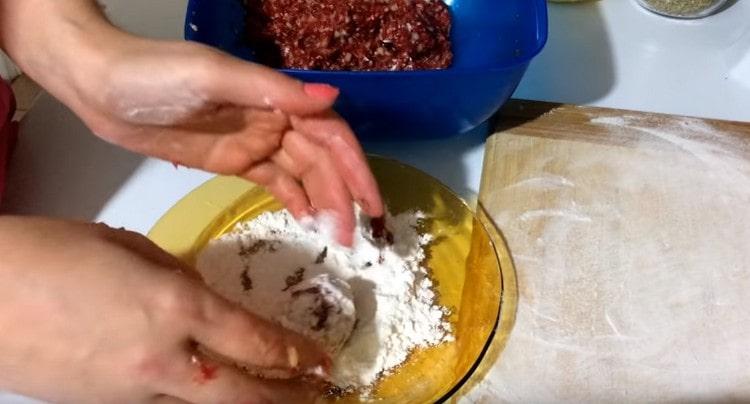 Bread meatballs in flour.