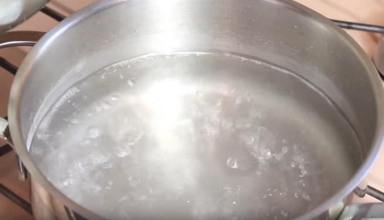 In a saucepan, bring the water to a boil.