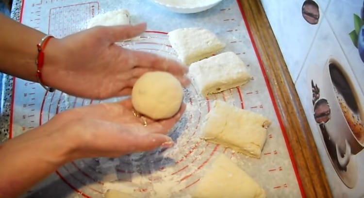 We roll each piece of dough into a ball.