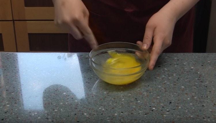 Beat the eggs in a bowl.
