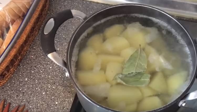 Boil the potatoes until tender.