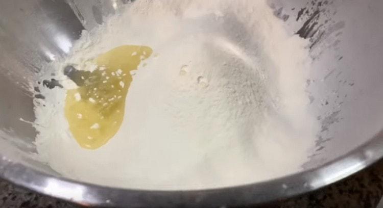 Add olive oil to the flour.