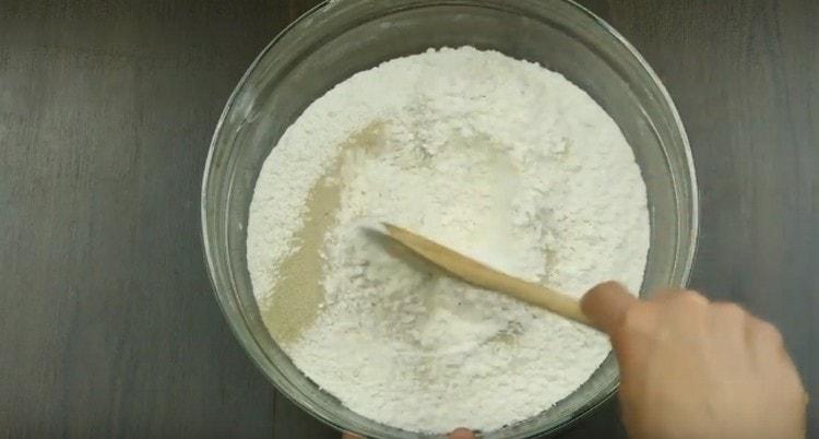 The sifted flour is mixed with dry yeast.