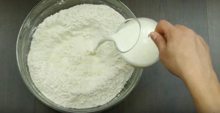 Add warm milk to the flour with yeast.