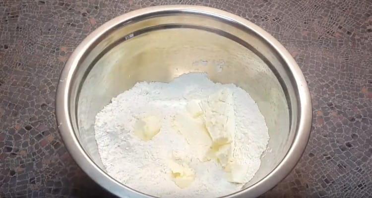 Add pieces of butter to flour and salt.