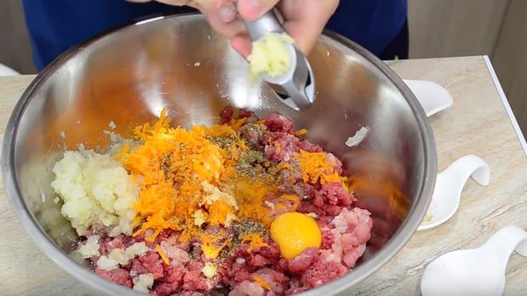Add the egg, salt, spices, garlic to the minced meat.