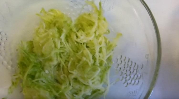 Grate zucchini.
