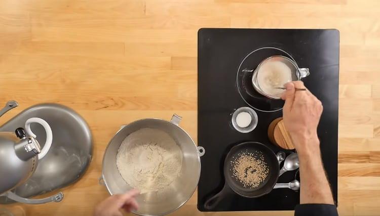 Add sugar to the yeast, mix.