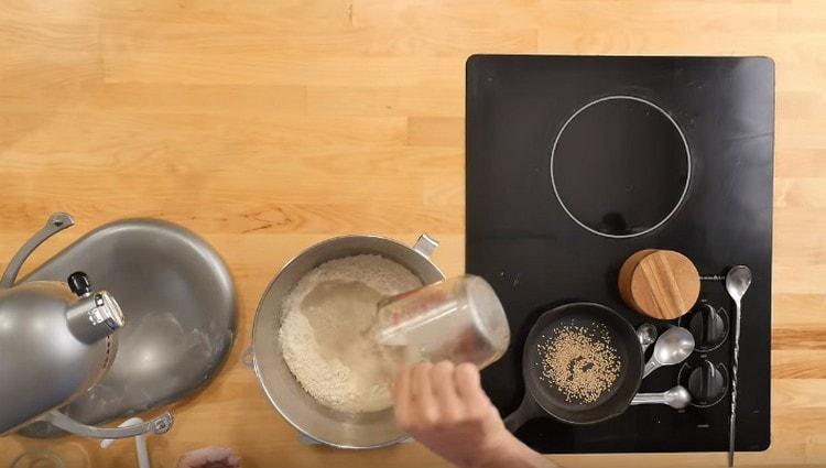 Pour the yeast mixture into the flour.