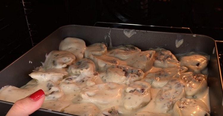 Pour pasta with sauce and put in the oven.