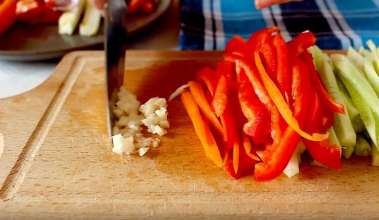 Grind garlic into pulp.