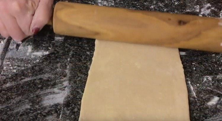 We fold the dough again and roll it again.