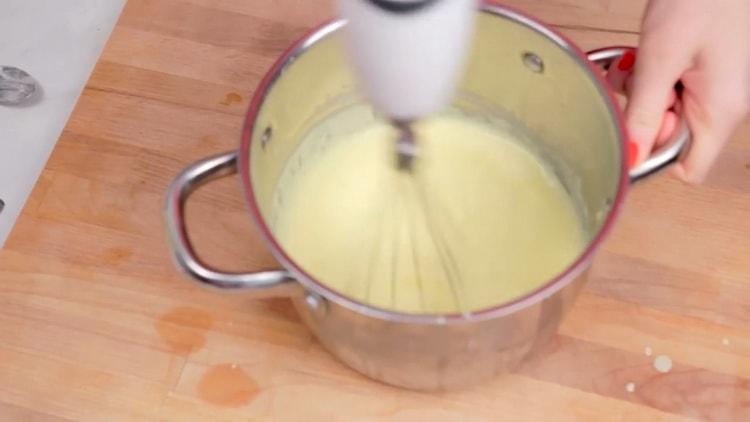 Stir the ingredients to make a pudding.