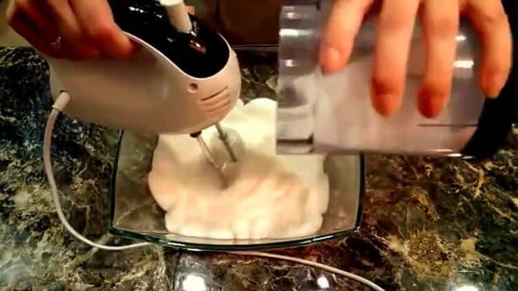 Beat eggs and sugar to make meringues.