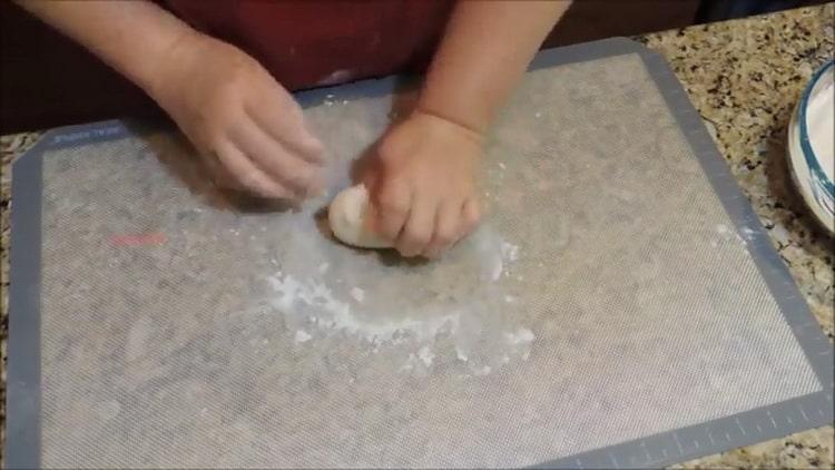 Knead the dough to make homemade noodles.