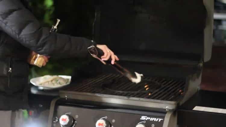 To grill squid, prepare the grill