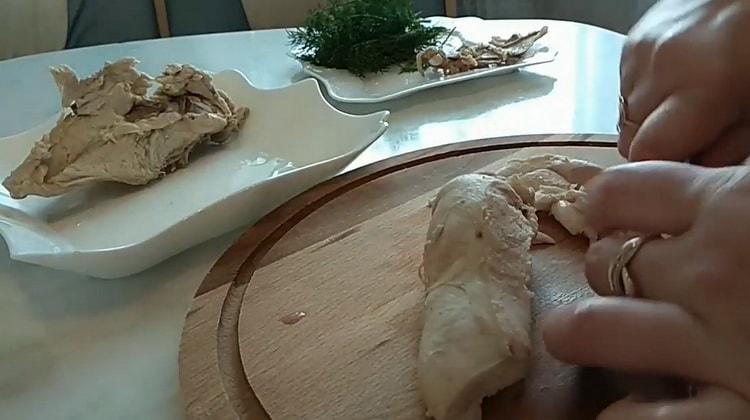 To cook noodle soup, chop the meat