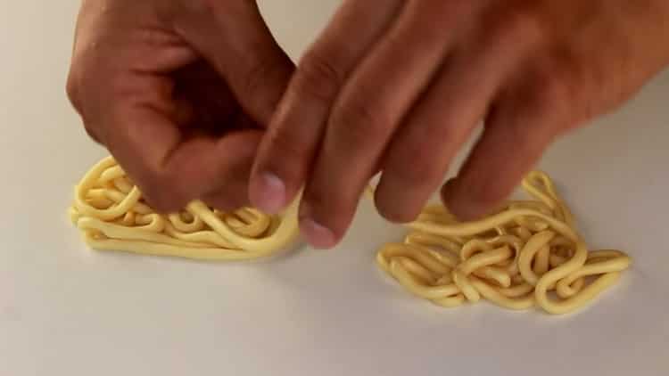 To make lagman noodles, stretch the bundles