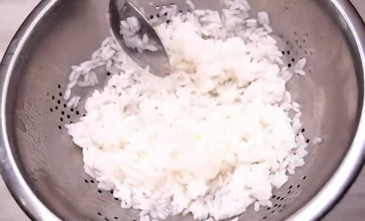 To cook stuffed cabbage, boil rice