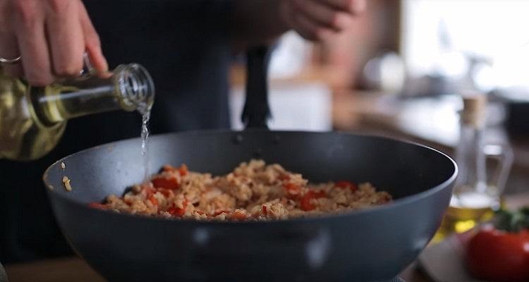 When the water evaporates, add white dry wine to the dish.