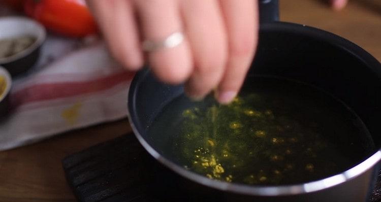 We heat the broth, add a pinch of saffron to it.