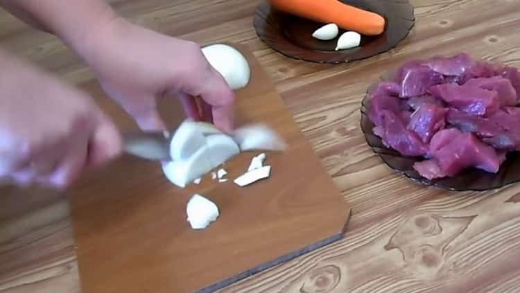To make pearl barley with meat, chop onion