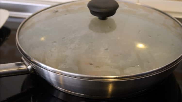 To make squid rice, cover the ingredients with a lid