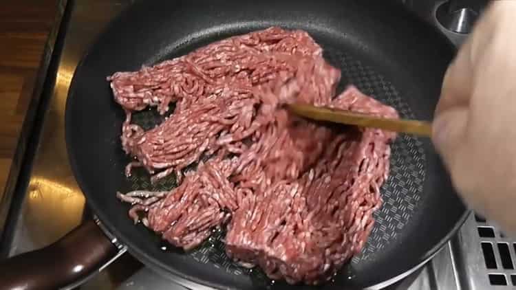 To cook rice with beans, sauté minced meat