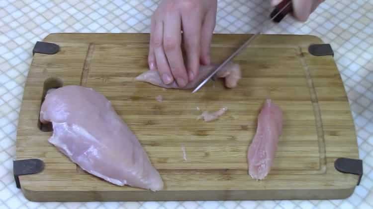 To cook rice noodles, chop the meat