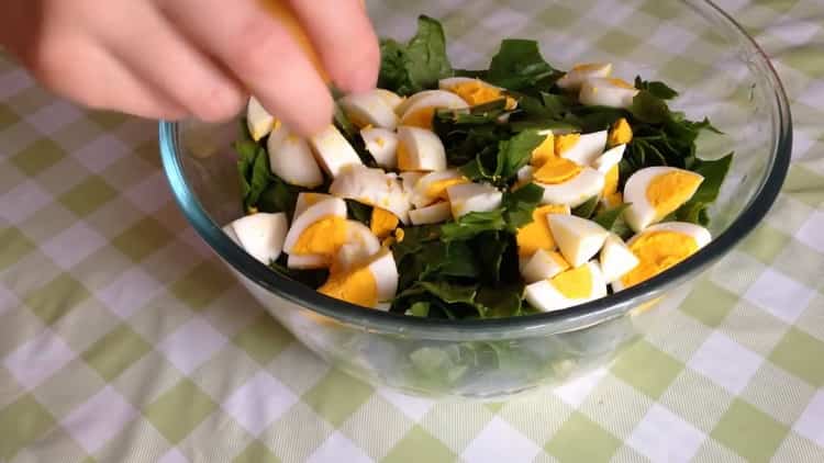 Cut eggs to make a salad