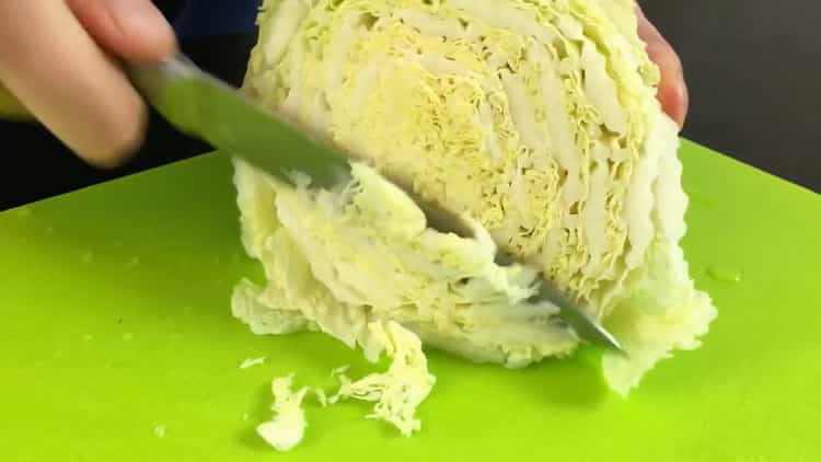 To make a salad, chop cabbage