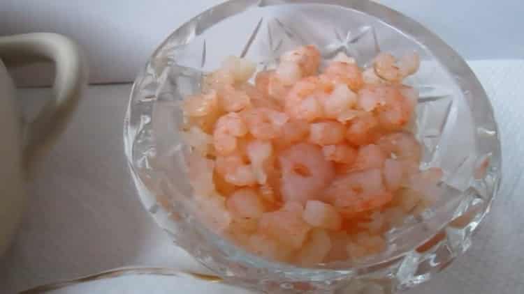 Cooking shrimp and crab sticks salad