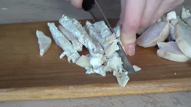 To make a salad, chop the chicken